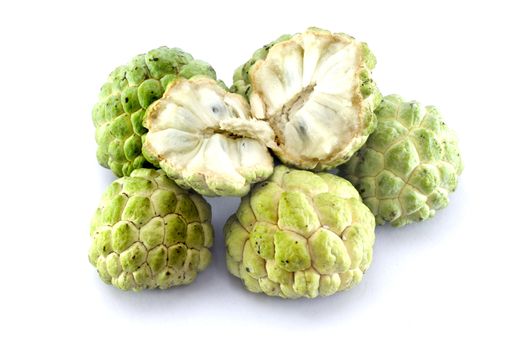 Custard apples group and opened one on white background with isolate.