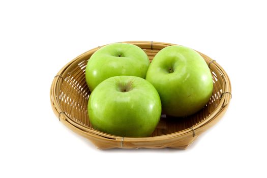 Three apples on the basket and white background.