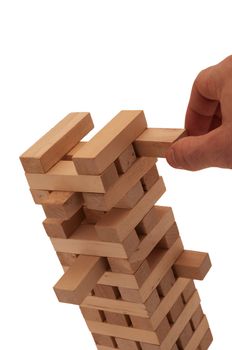 Tower of wooden blocks on white background