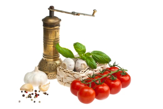 Garlic, tomatoes, basil shot on a white background.