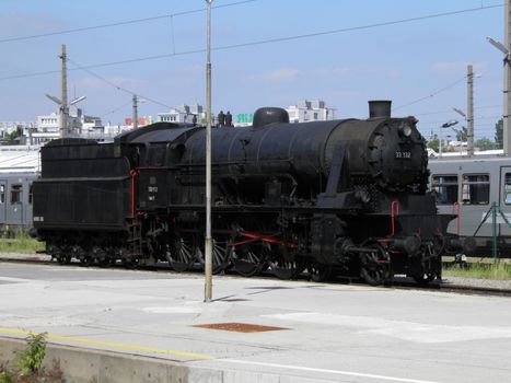 Steam engine train locomotive in a station