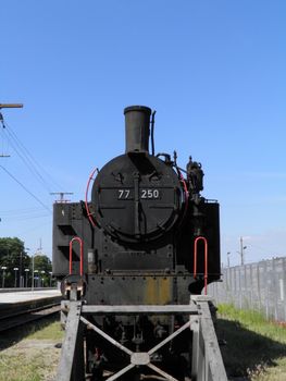 Steam engine train locomotive in a station