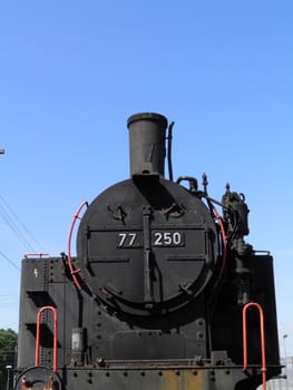 Steam engine train locomotive in a station