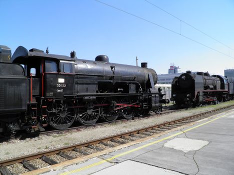 Steam engine train locomotive in a station