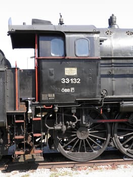 Steam engine train locomotive in a station