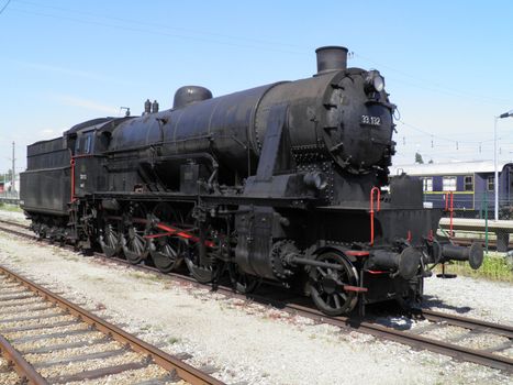Steam engine train locomotive in a station