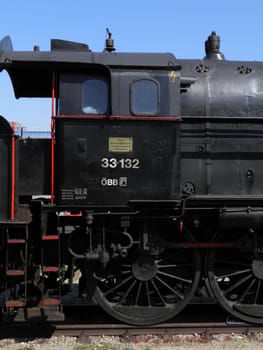 Steam engine train locomotive in a station