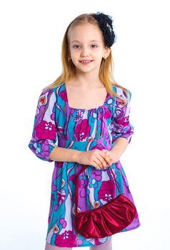 Young an elegant girl model in colorful dress. Isolated on white background