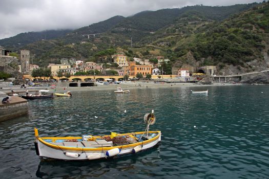 A fishing boat moored in the harbor of Monterosso al Mare.  Monterosso is one of the five villages that make up Cinque Terre.  Located on the rugged coast of the Italian Riviera in the Liguria region of Italy.
