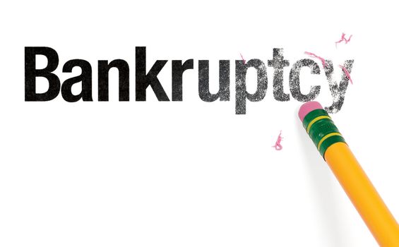 Close up of a yellow pencil erasing the word, 'Bankruptcy.' Isolated on white.