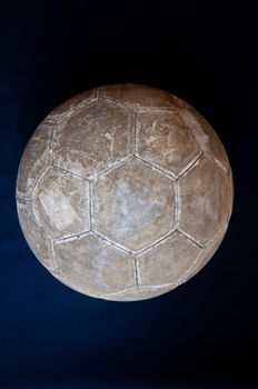 old football on black background