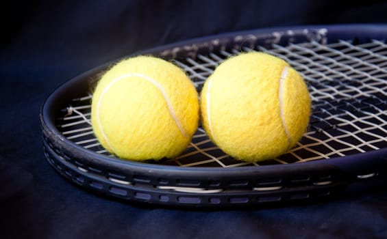 tennis ball on racket