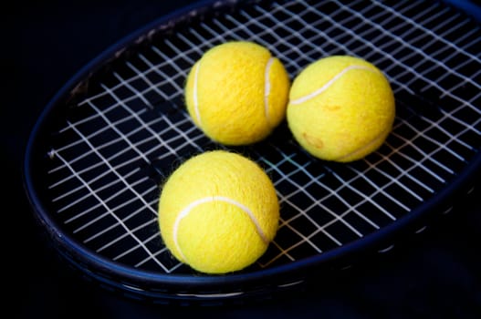 tennis ball on racket