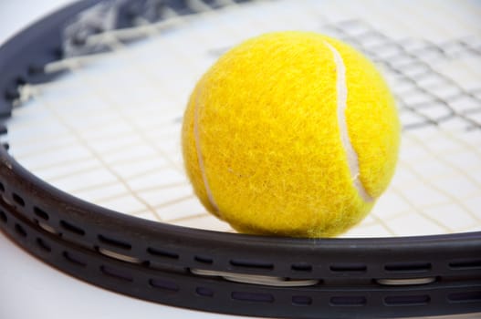 tennis ball on racket