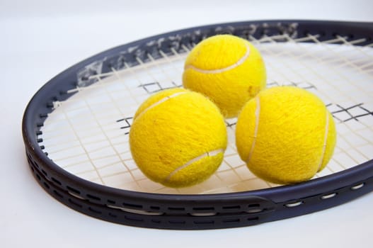 tennis ball on racket