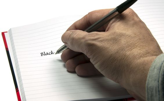 hand with pen writing black