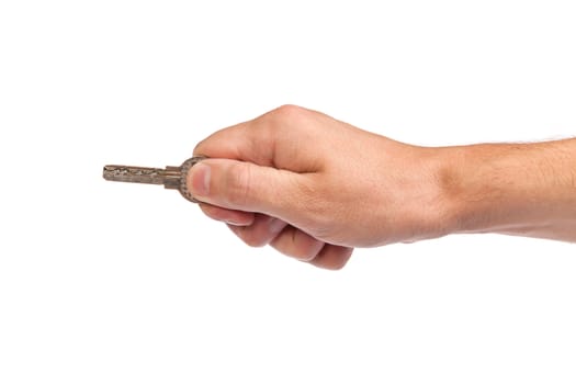 Male hand holding a key to the house, image is taken over a white background.