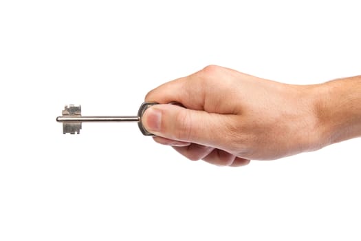 Male hand holding a key to the house, image is taken over a white background.