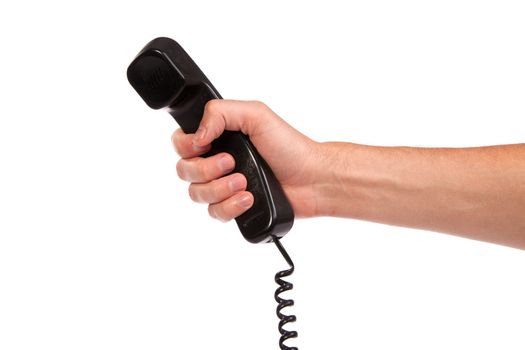 Hand holding an old black telephone tube isolated on white background