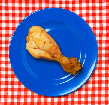 BBQ chicken drumstick on plate.