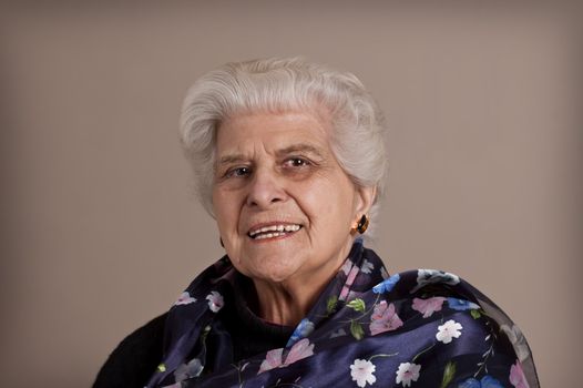 Senior lady portrait, smiling with copy space. 