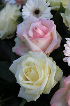 big pink and white roses in flower arrangement