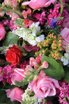 Mixed bouquet in bright colors, pink and red roses