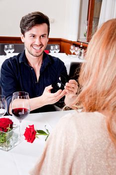 happy couple in restaurant romantic date love dinner valentines day wedding
