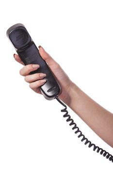 Hand holding an old black telephone tube isolated on white background