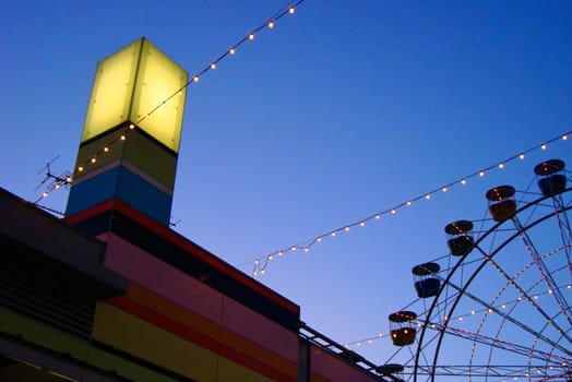 Lights and Ferris Wheel with Dusky Blue Sky taken at Luna Park, Sydney, Australia. Landscape Orientation.