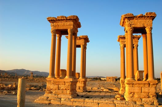 Relics Palmyra in Syria against blue sky. Ancient Roman time town in Palmyra (Tadmor), Syria.