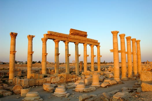 Relics Palmyra in Syria against blue sky. Ancient Roman time town in Palmyra (Tadmor), Syria.