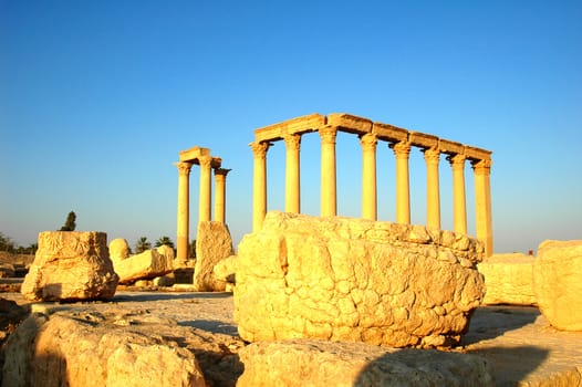 Relics Palmyra in Syria against blue sky. Ancient Roman time town in Palmyra (Tadmor), Syria.