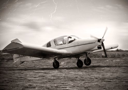 Vintage image of a plane take of:NOTE-Texture was added to simulate an old image.
