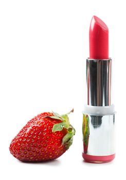 Lipstick and a strawberry isolated over white background
