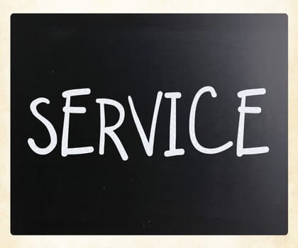 "Service" handwritten with white chalk on a blackboard