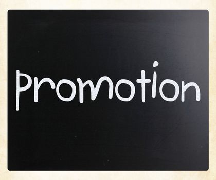 The word "promotion" handwritten with white chalk on a blackboard