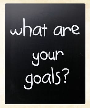 "What are your goals?" handwritten with white chalk on a blackboard