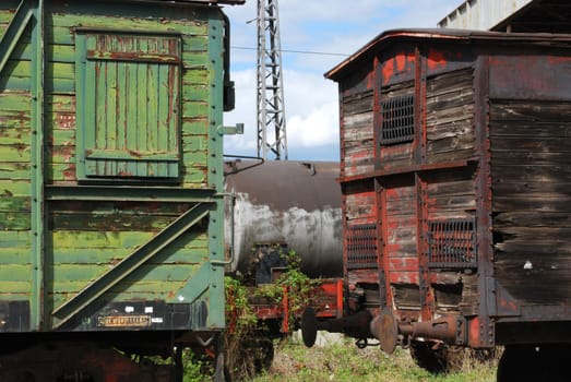 Old vintage wooden railway wagons and cistern