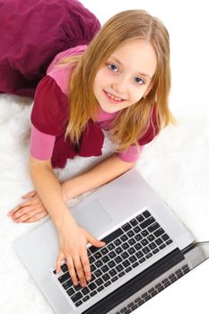 Attractive young girl using notebook computer. Isolated on white background.