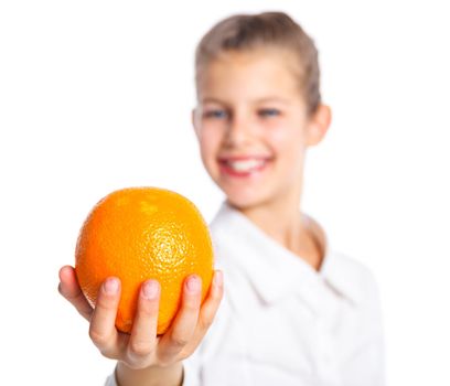 Portrait of happy cute little girl with orange. Focus on the orange. Isolated over white background.