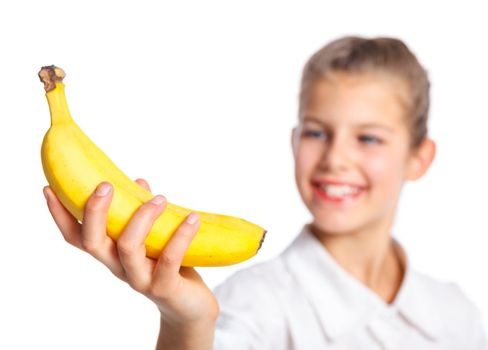 Portrait of happy cute little girl with banana. Focus on the banana. Isolated over white background.
