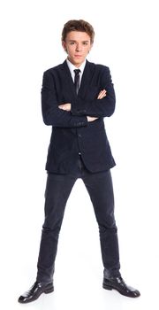 Teenage boy in a business suit. Isolated on white background.