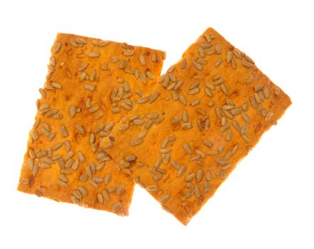 Crackers with sunflower seeds, isolated against background