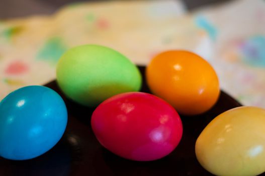 Close-up of coloured easter eggs on a plate