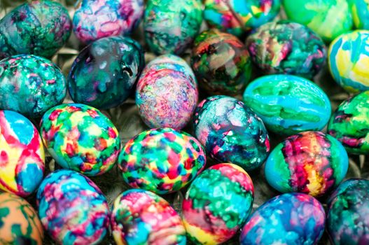 Close-up of multi-coloured easter eggs on a tray