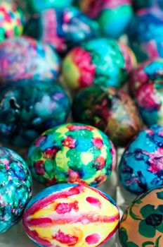 Close-up of multi-coloured easter eggs on a tray