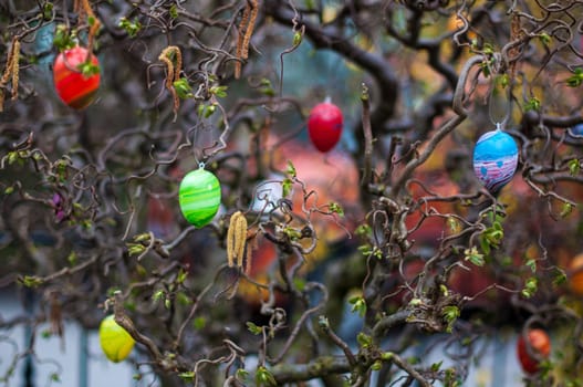 close-up of an easter tree decorated with colorful eggs