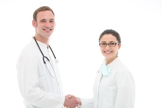 Smiling young male doctor congratulating his assistant or nurse on a successful outcome as a medical team