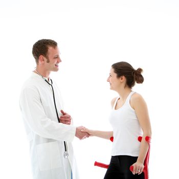 Smiling, kind doctor shaking hands with his female patient